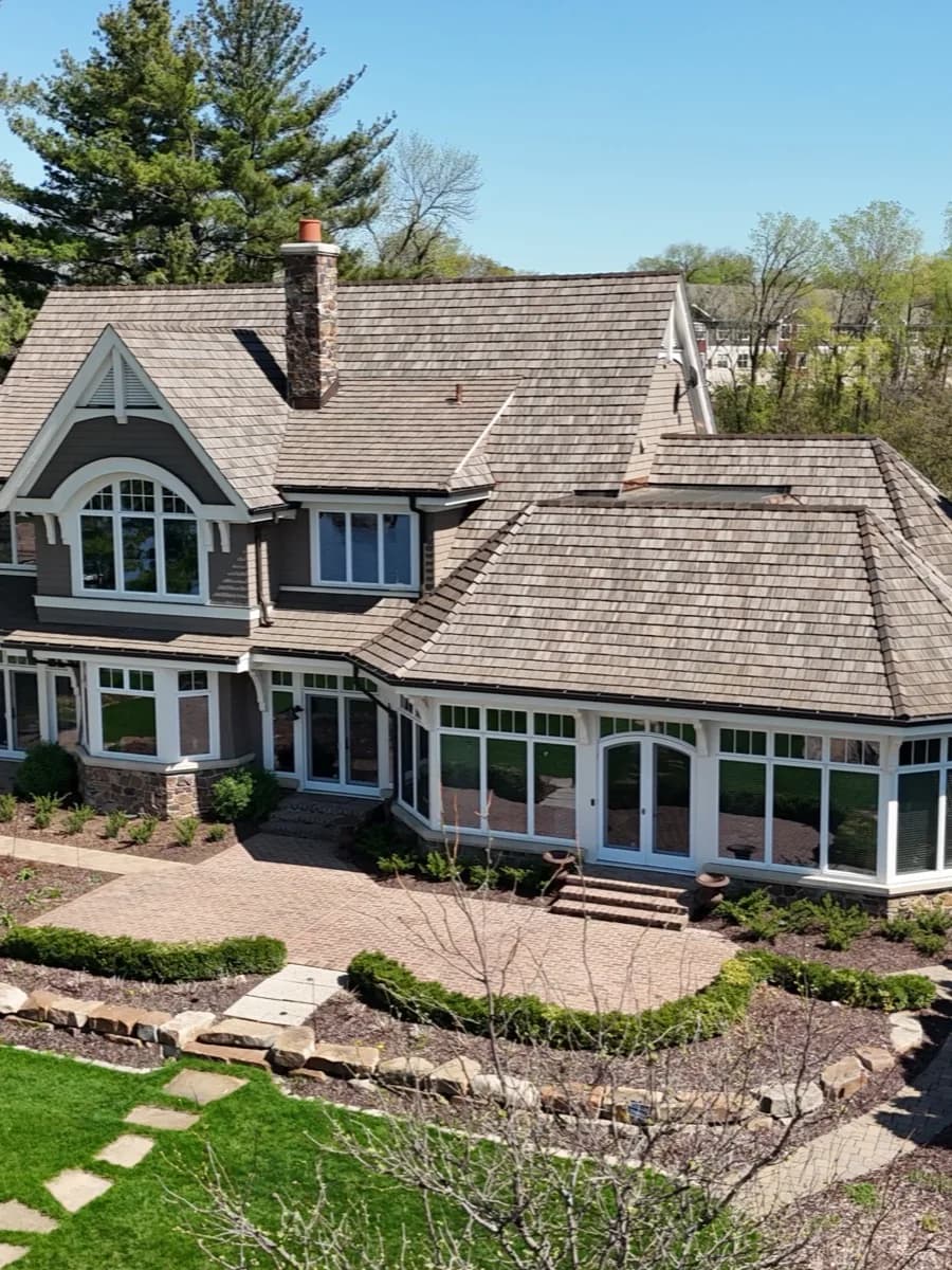 Custom Twin Cities lake home with new cedar shake roof by Les Jones Roofing