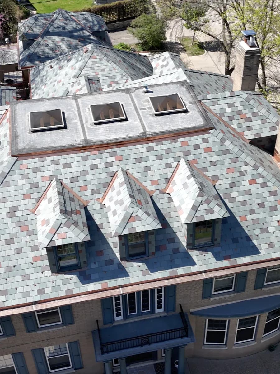 Slate-style roof with custom dormers installed by Les Jones Roofing